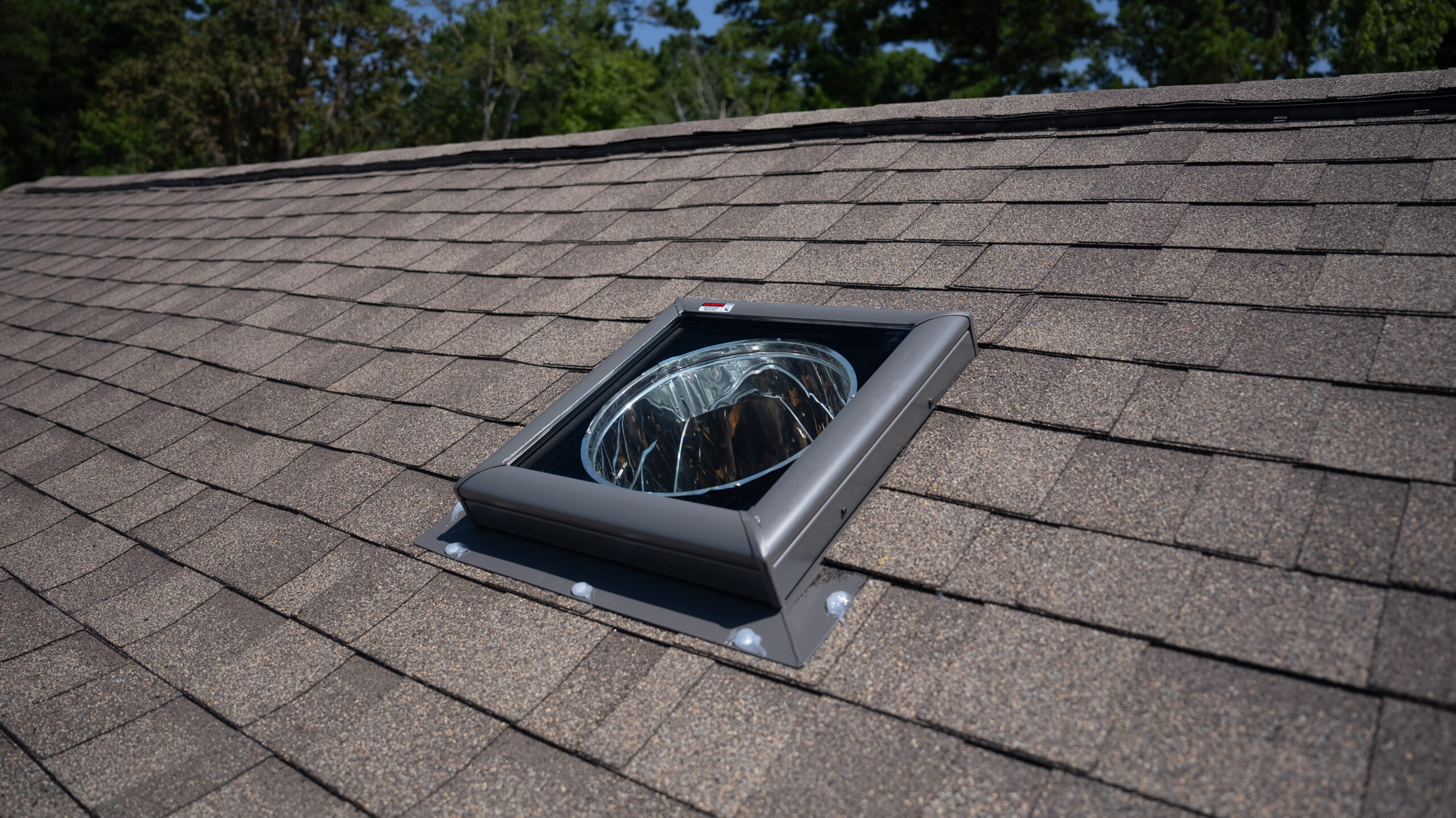 After Natural Daylighting - Before and after sun tunnel installation by North Star Skylights showing small roof opening solution for Minnesota roofers enhancing natural light